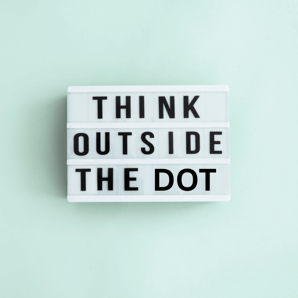 A plain light blue background with "Think outside of the dot" written on a sign. The purpose of this picture is to encourage people to think outside of the one thing that they obsess over. The dot represents the one wrong thing. We need to look beyond your limits.